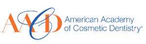 The image shows a logo with text that reads AMERICAN ACADEMY OF DENTAL AESTHETICS and includes a design element resembling a stylized human face, along with an emblem featuring a ring of stars around the upper half of a letter A .